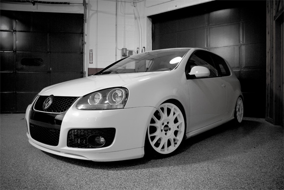 Black and white photo of 2008 Volkswagen GTI dropped on a set of 19 BBS CH